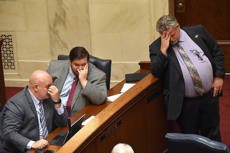 Republican Sens. Mathew Pitsch of Fort Smith, (from left) Ben Gilmore of Crossett and Alan Clark of Lonsdale listen to questions about a new motion Thursday at the state Capitol.
(Arkansas Democrat-Gazette/Staci Vandagriff)