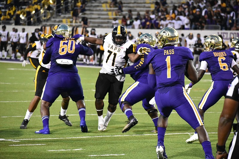 UAPB defensive lineman Zion Farmer breaks through the Prairie View A&M offensive line to get to quarterback Jawon Pass in the first quarter Thursday in Prairie View, Texas. 
(Pine Bluff Commercial/I.C. Murrell)