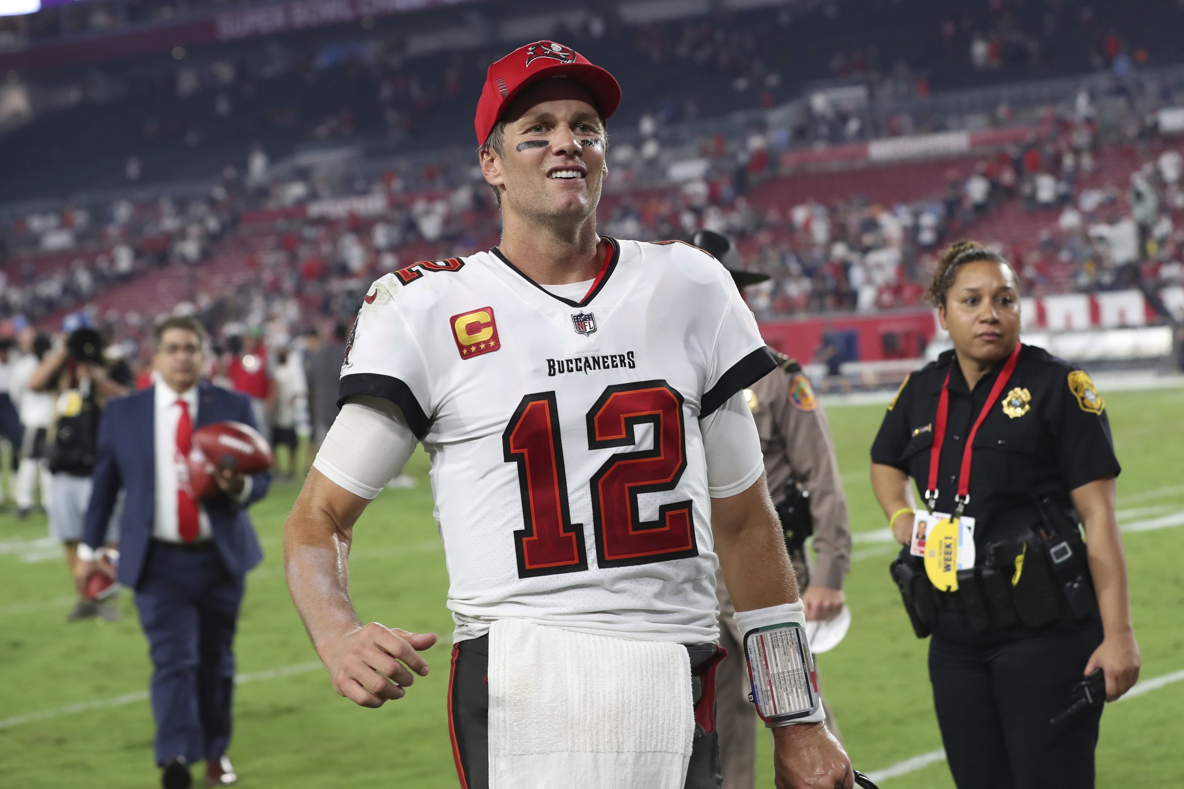 Brett Favre walks the sideline as a member of the Atlanta Falcons