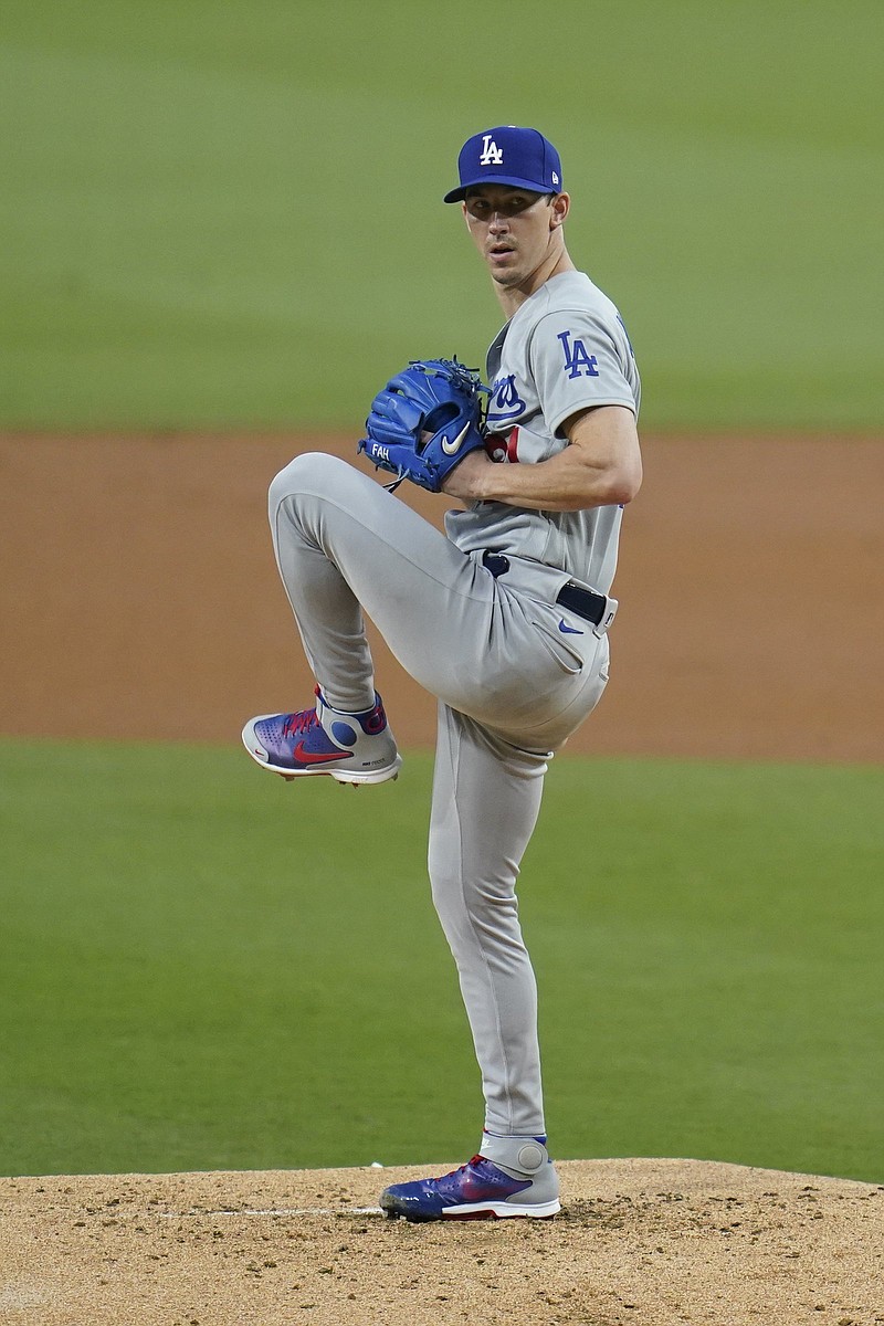 Los Angeles Dodgers starting pitcher Walker Buehler works against a San Diego Padres batter during the first inning of a baseball game Wednesday, Aug. 25, 2021, in San Diego. (AP Photo/Gregory Bull)