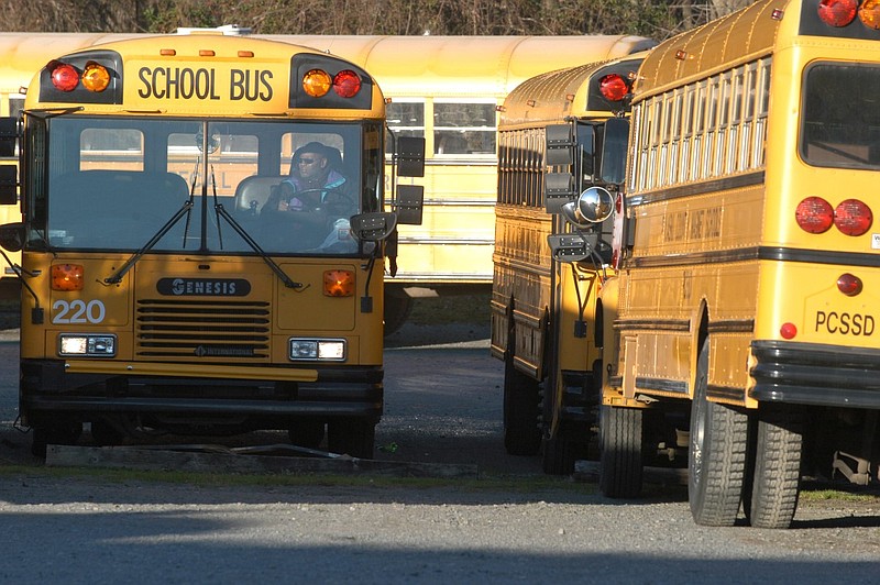 A Pulaski County Special School District bus driver parks at a bus yard in Sweet Home in this February 2004 file photo. (Arkansas Democrat-Gazette file photo)