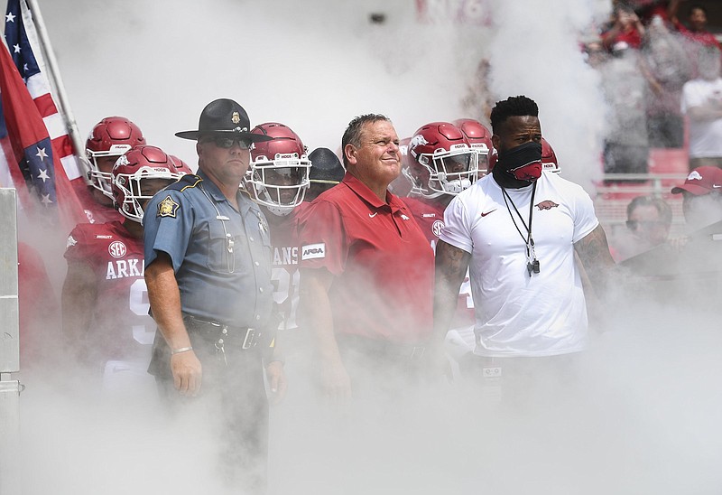 Arkansas Coach Sam Pittman (center), whose No. 8 Razorbacks take on No. 2 Georgia today in Athens, Ga., was the Bulldogs’ offensive line coach in 2016-19 before taking  over the Arkansas program. While in high school, he was impressed by Georgia’s 1980 national championship team and its freshman running back, Herschel Walker.
(NWA Democrat-Gazette/Charlie Kaijo)