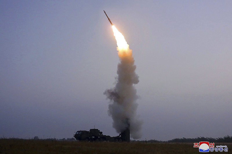 This photo from the North Korean government Friday shows what it claims to be the test firing of a newly developed anti-aircraft missile on Thursday. Video at arkansasonline.com/102nkmissile/.
(AP/Korea News Service/Korean Central News Agency)