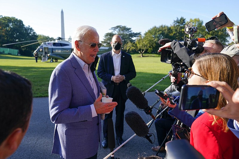 President Joe Biden speaks with members of the press before boarding Marine One on the South Lawn of the White House in Washington on Saturday, Oct. 2, 2021. Biden is spending the weekend at his home in Delaware. (AP/Patrick Semansky)