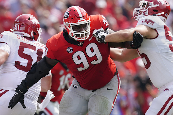 Georgia defensive tackle Jordan Davis holds a jersey after being