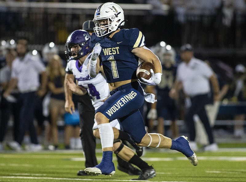 Bentonville West junior running back Carson Morgan had two long touchdown runs in the Wolverines’ 40-0 victory over Springdale after missing spring workouts because of an ankle injury, then sitting out preseason drills because of covid-19.
(Special to the NWA Democrat-Gazette/David Beach)