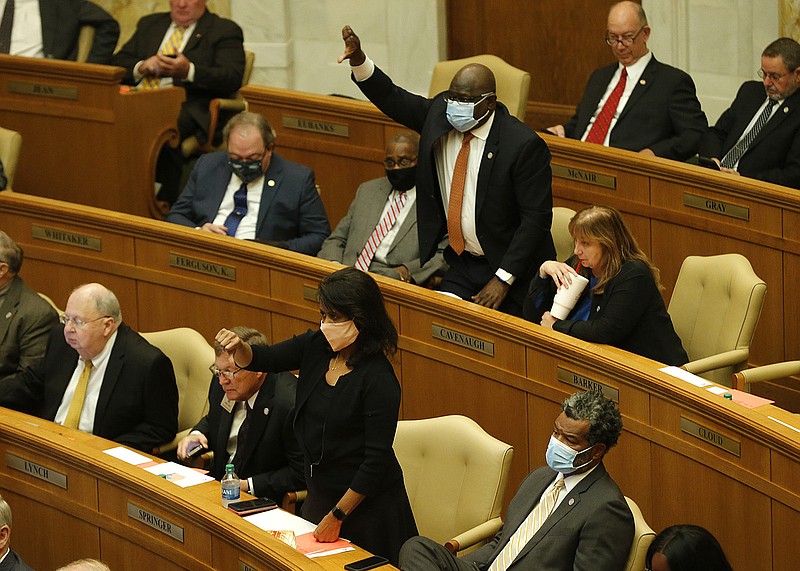 Reps. Fred Allen (top center) and Joy Springer (bottom center), both D-Little Rock, express their intent to speak against the House congressional redistricting bill Wednesday. Several lawmakers who spoke against it said it was possible to draw a map with low population deviation without splitting counties and that the plan would eliminate the possibility of Arkansas electing a Black person to Congress. More photos at arkansasonline.com/107session/.
(Arkansas Democrat-Gazette/Thomas Metthe)