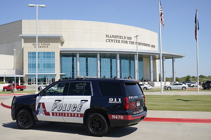 An Arlington, Texas, police vehicle sits outside the Mansfield school district’s Center For The Performing Arts on Wednesday where families were being reunited with their children after a school shooting at Timberview High School in nearby Arlington.
(AP/Tony Gutierrez)