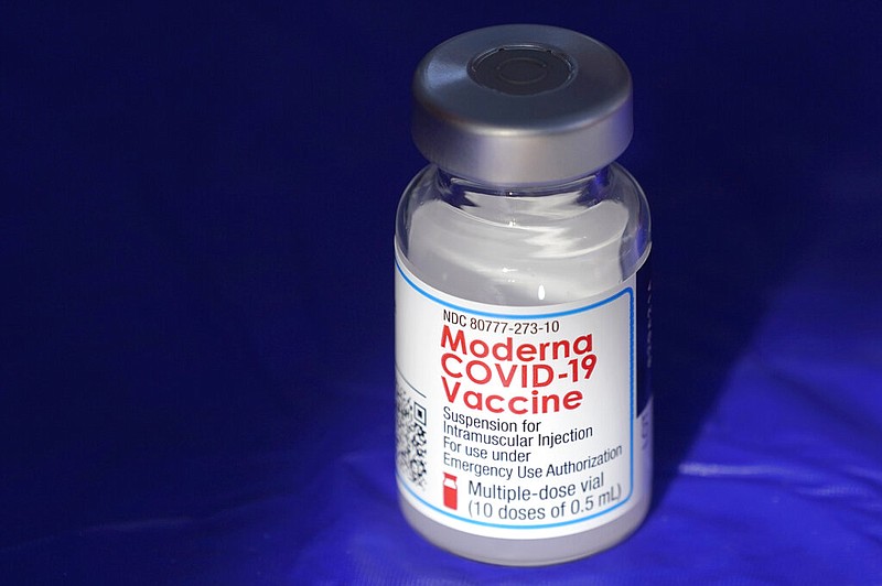 A vial of the Moderna covid-19 vaccine rests on a table at a drive-up mass vaccination site in Puyallup, Wash., south of Seattle in this March 4, 2021, file photo. (AP/Ted S. Warren)