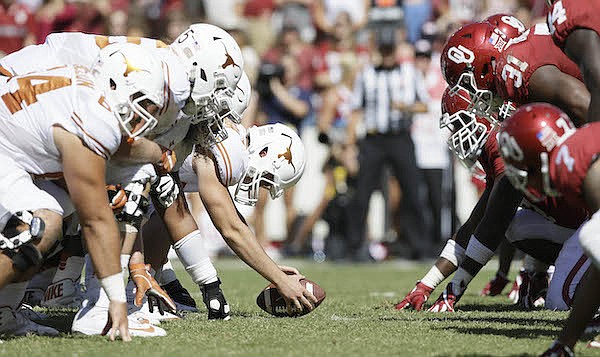 Oklahoma and Texas line up for play during the second half of an NCAA college football game in Dallas Saturday, Oct. 8, 2016. (AP Photo/LM Otero)