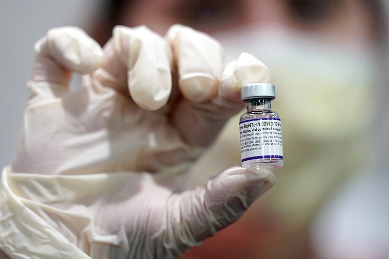 FILE - A healthcare worker holds a vial of the Pfizer covid-19 vaccine at Jackson Memorial Hospital in Miami, in this Tuesday, Oct. 5, 2021, file photo. (AP/Lynne Sladky, File)
