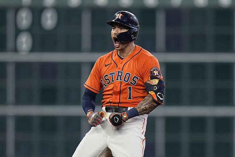Houston Astros shortstop Carlos Correa celebrates after hitting a  two-run double in the seventh inning of the Astros’ victory over  the Chicago White Sox in Game 2 of their American League  division series in Houston.
(AP/David J. Phillip)