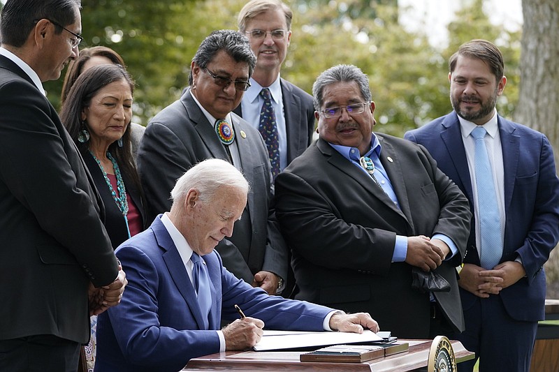 President Joe Biden signs proclamations Friday at the White House in an event announcing that his administration is restoring protections for two sprawling national monuments in Utah that have been at the center of a long-running public lands dispute, as well as a marine conservation area in New England that recently has been used for commercial fishing.
(AP/Susan Walsh)