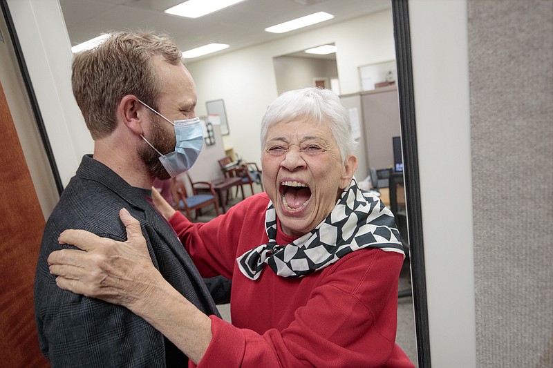 Former KUAR-KLRE staff member and current volunteer Mary Waldo and with stations' General Manager Nathan Vandiver celebrate the announcement that an anonymous donor has given the public radio stations a $1.5 million endowment.
(Special to the Democrat-Gazette/Benjamin Krain)