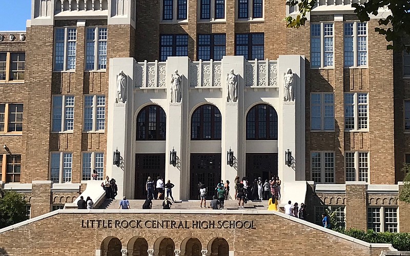 People stand outside Little Rock Central High after a report of shots fired at the school Monday. (Photo by Tommy Metthe)