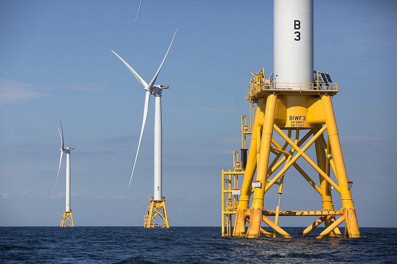 Three Deepwater Wind turbines stand in the water off Block Island, R.I., the nation’s first offshore wind farm. (AP file photo)