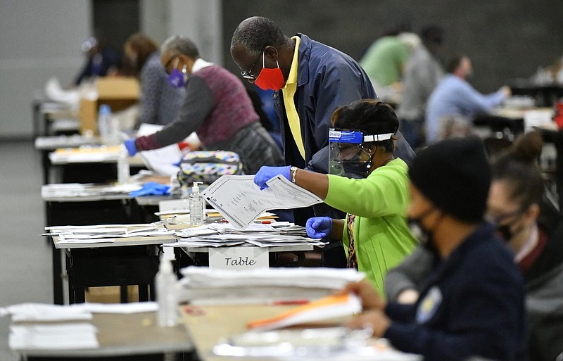 Election workers in Atlanta begin a recount of Fulton County ballots on Nov. 14.
(AP file photo)