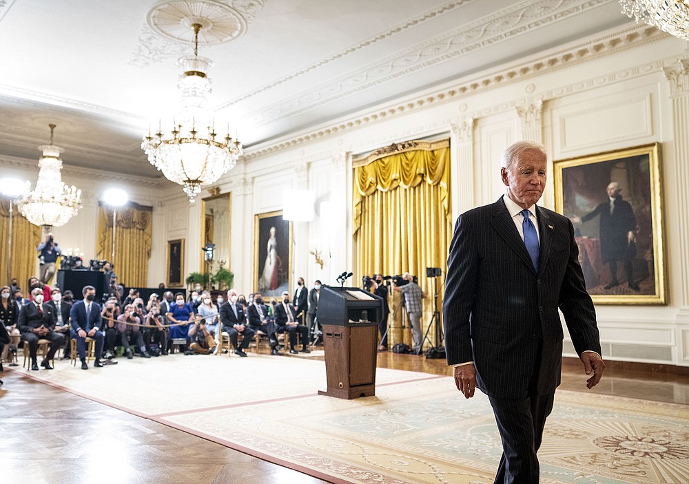 President Joe Biden leaves  the East Room of  the White House on Wednesday after announcing  plans to clear the nation’s backed-up freight-moving system. He said the Port of Los Angeles would  begin operating 24 hours a day, joining its counterpart in Long Beach. The ports together account for 40% of all shipping containers entering the United States.
(The New York Times/Doug Mills)
