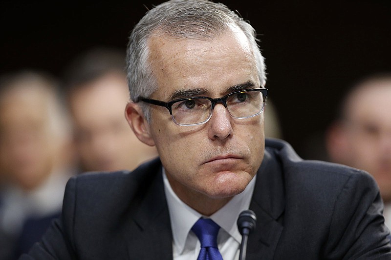 FILE - In this June 7, 2017, file photo, former FBI acting director Andrew McCabe listens during a hearing on Capitol Hill in Washington. McCabe, who was fired by President Donald Trump after allegations that he misled the Justice Department's inspector general, has won his pension back under a settlement with the federal government. (AP Photo/Alex Brandon, File)