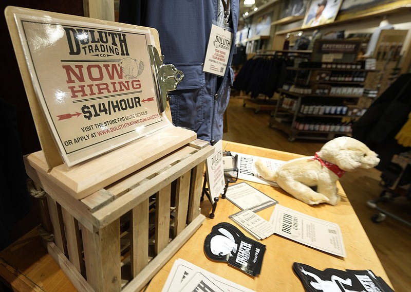 A now hiring sign sits on a display in a clothing store in Sioux Falls, S.D. The number of Americans filing initial unemployment claims fell below 300,000 last week for the first time since the pandemic, the Labor Department reported Thursday.
(AP/David Zalubowski)