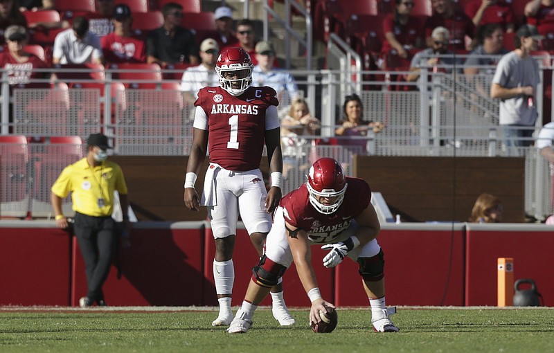 Arkansas’ Ty Clary prepares to snap the ball to quarterback KJ Jefferson against Georgia Southern on Sept. 18. Clary has played three positions along the Razorbacks’ offensive line this season and is expected to start at right tackle Saturday against Auburn, filling in for injured Dalton Wagner.
(NWA Democrat-Gazette/Charlie Kaijo)