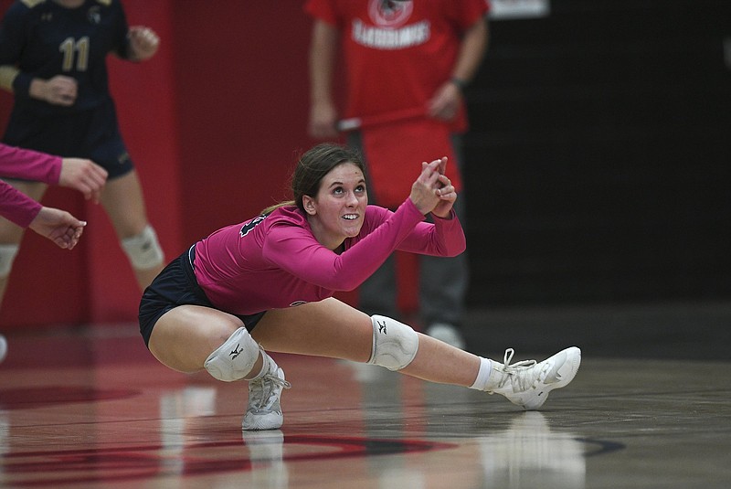 Shiloh Christian’s Kate Brown digs a ball during Thursday’s 4A-Northwest Conference match against Pea Ridge at Pea Ridge Arena. The Lady Saints rallied for a 20-25, 23-25, 25-21, 25-18, 15-7 victory to improve to 16-0 in the conference.
(NWA Democrat-Gazette/Charlie Kaijo)