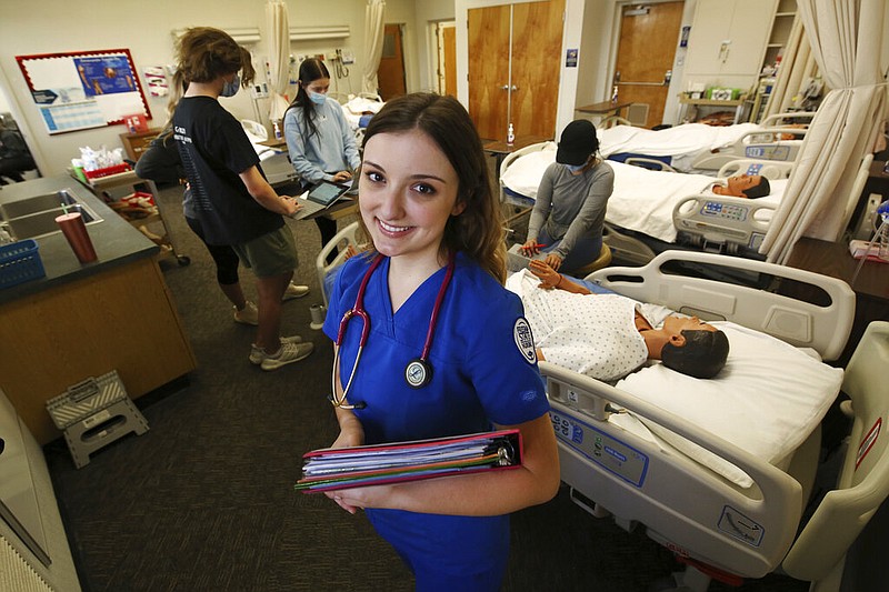 First year nursing student, Emma Champlin, poses for a photo in her clinical laboratory class at Fresno State on Wednesday, Oct. 13, 2021, in Fresno, Calif. (AP/Gary Kazanjian)