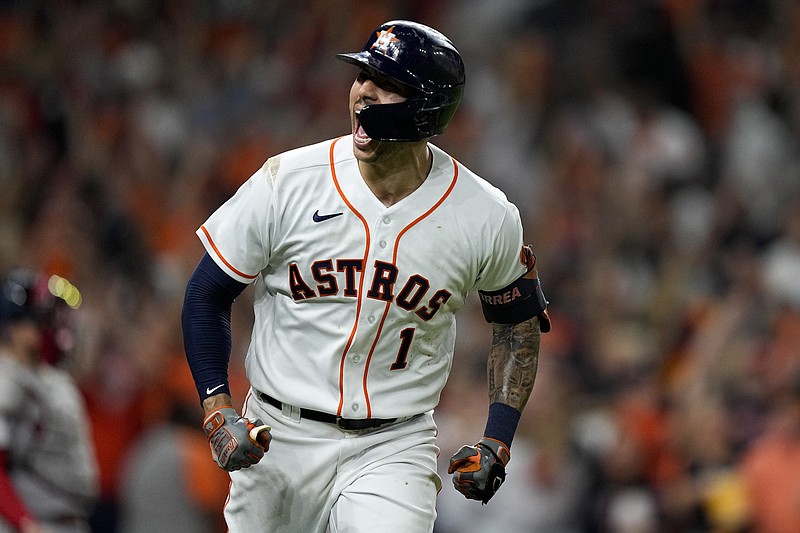 Carlos Correa of the Houston Astros celebrates as he rounds the bases after hitting a home run in the seventh inning of the Astros’ victory over the Boston Red Sox on Friday night in Game 1 of American League Championship Series.
(AP/David J. Phillip)
