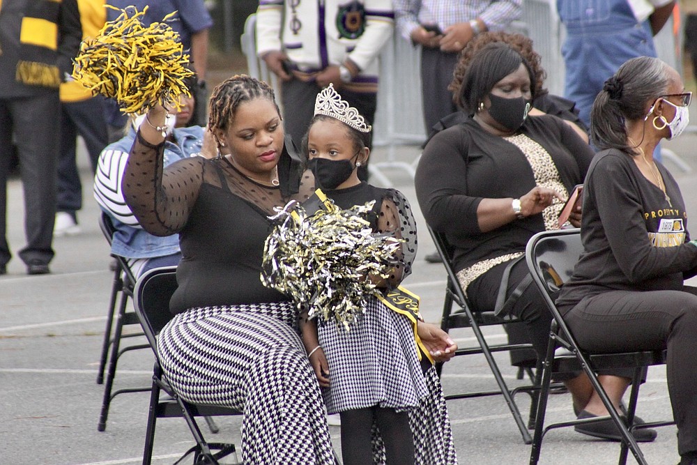 UAPB Alum Sharakee Geiggar and her daughter, the 2021 Little Miss UAPB Sharyiah Geiggar, cheer as the UAPB marching band performs.
(Pine Bluff Commercial/Eplunus Colvin)