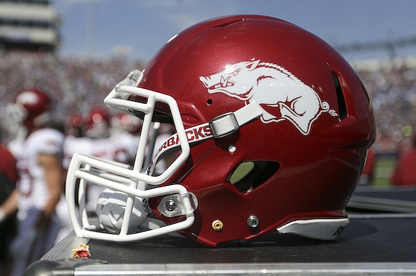 An Arkansas football helmet sits on the sideline during a game against Ole Miss on Saturday, Oct. 9, 2021, in Oxford, Miss.