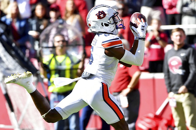 Auburn receiver Ja'Varrius Johnson (6) scores a touchdown against Arkansas during the first half in Fayetteville on Saturday, Oct. 16, 2021. (AP/Michael Woods)