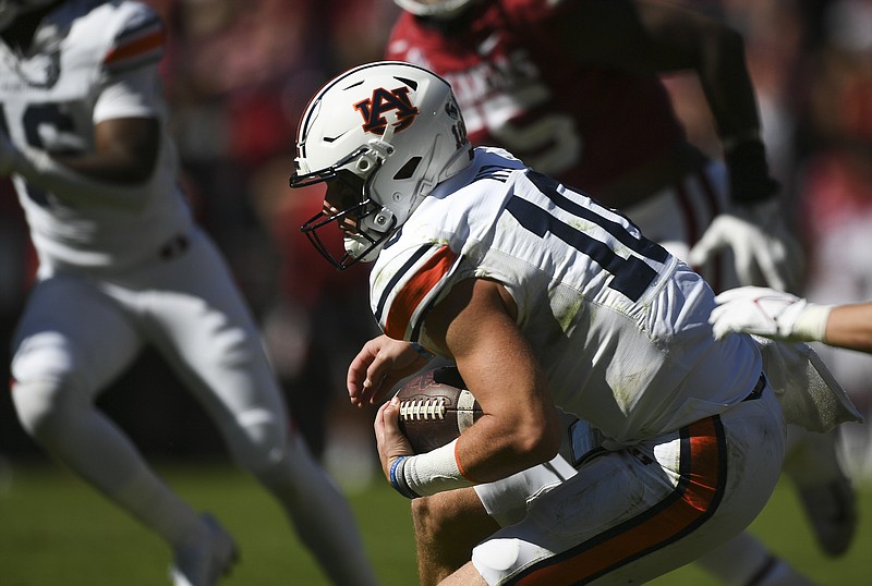 Auburn quarterback Bo Nix (10) carries the ball for a score, Saturday, October 16, 2021 during the fourth quarter of a football game at Reynolds Razorback Stadium in Fayetteville. Check out nwaonline.com/211017Daily/ for today's photo gallery. .(NWA Democrat-Gazette/Charlie Kaijo)