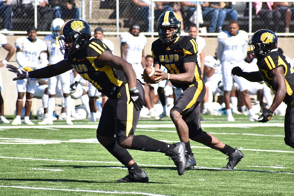 UAPB quarterback Skyler Perry drops back for a pass with blocking from Rolando Jones (51) in the first quarter. Perry exited the game after completing 4 of 6 passes for 55 yards. 
(Pine Bluff Commercial/I.C. Murrell)