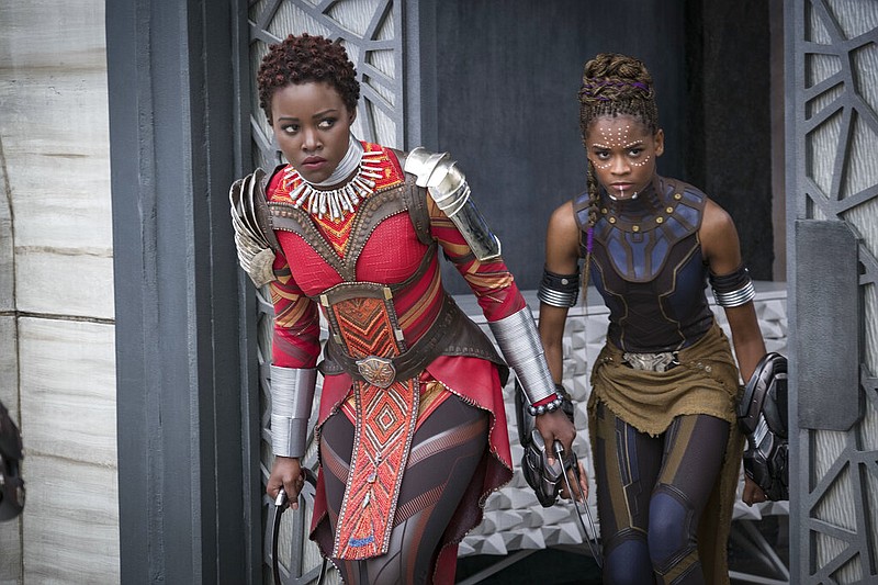 This image released by Disney shows Lupita Nyong'o, left, and Letitia Wright in a scene from Marvel Studios' "Black Panther." The Walt Disney Co. is pushing back the release dates of many of its upcoming titles, including the Black Panther sequel "Wakanda Forever," which is currently in production. (Matt Kennedy/Marvel Studios-Disney via AP)