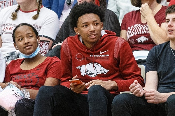 Arkansas basketball commit Nick Smith watches the Razorbacks' Red-White game on Sunday, Oct. 17, 2021, during the first half of play at Barnhill Arena, Fayetteville.