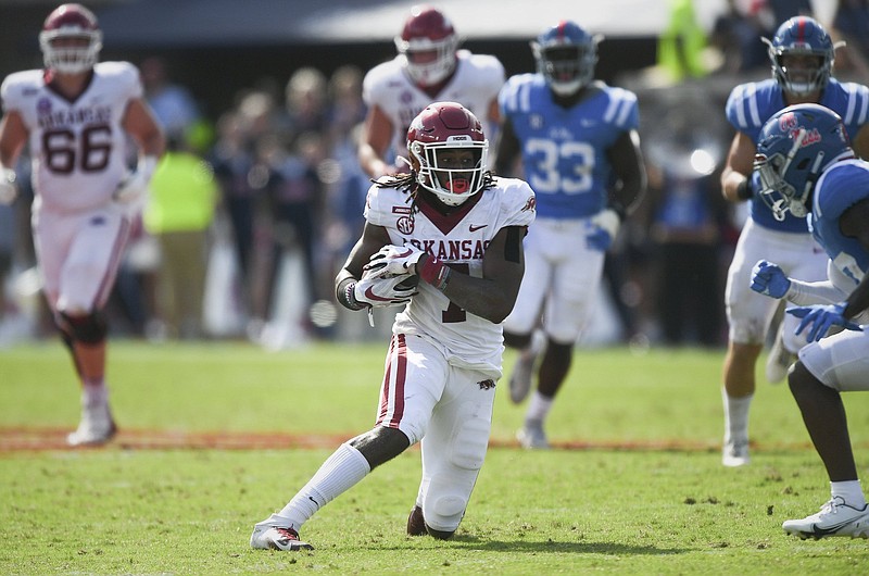 Arkansas wide receiver Trey Knox (7) carries the ball, Saturday, October 9, 2021 during the fourth quarter of a football game at Vaught Hemingway Stadium in Oxford, Miss. Check out nwaonline.com/211010Daily/ for today's photo gallery. .(NWA Democrat-Gazette/Charlie Kaijo)