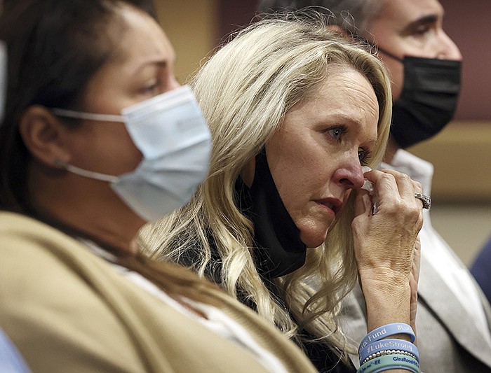 Gena Hoyer wipes tears as her son’s name is read aloud with those of other victims during Nikolas Cruz’s guilty plea Wednesday at the Broward County Courthouse in Fort Lauderdale, Fla. Hoyer’s son, Luke, was 15.
(AP/South Florida Sun Sentinel/Amy Beth Bennett)