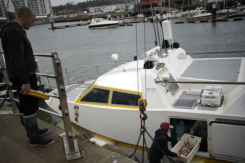 French fishermen empty their boat Friday at the port of Boulogne-sur-Mer in northern France.
(AP/Christophe Ena)