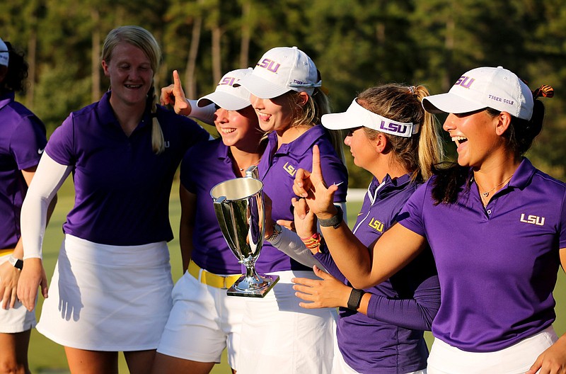 LSU players celebrate Wednesday after beating South Carolina in match play during the final day of competition in the Jackson T. Stephens Cup at The Alotian Club in Roland. For more photos, see arkansasonline.com/1021stephens/.
(Arkansas Democrat-Gazette/Thomas Metthe)