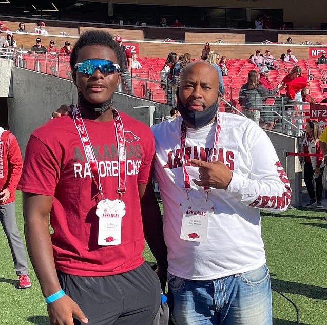 2023 defensive lineman Trey Wilson and his father Jay before the start of Arkansas' game against Auburn.