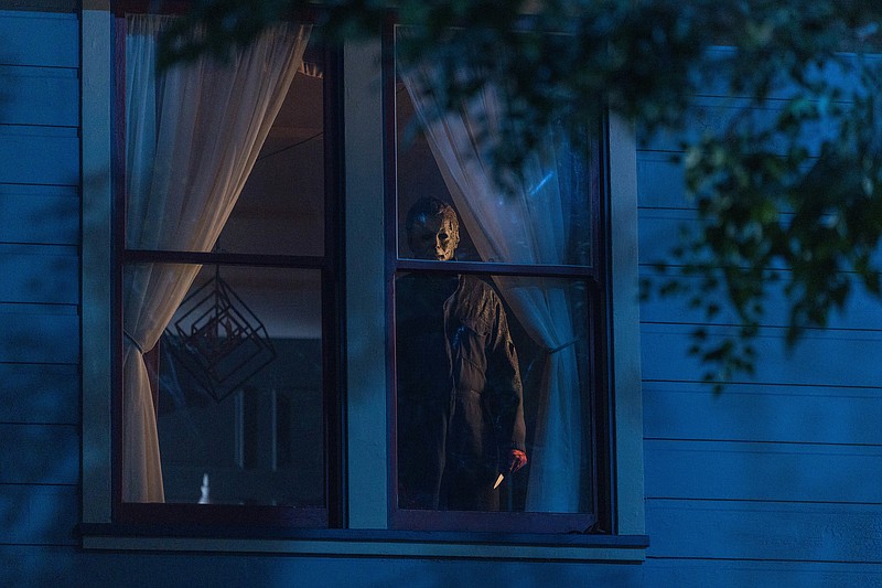 James Jude Courtney peers through a window as “ The Shape” in the spooky ooky “Halloween Kills.”