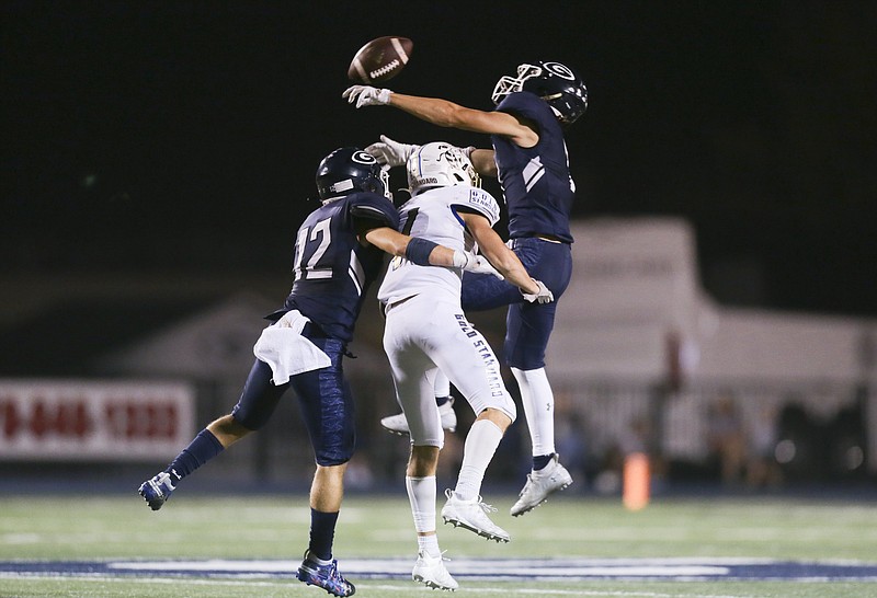 FILE -- Greenwood Sebastian Crumb (12) and cornerback Colin Daggett (7) break up a pass intended for a Choctaw receiver, Friday, September 18, 2020 during a football game at Greenwood High School in Greenwood. 
(NWA Democrat-Gazette/Charlie Kaijo)