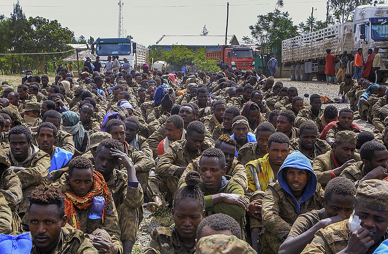 Captured Ethiopian soldiers and allied militia members sit in rows after being paraded by Tigray forces through the streets in open trucks on their way to a detention center Friday in Mekele, in northern Ethiopia. Ethiopian military airstrikes Friday forced a United Nations humanitarian flight to abandon its landing in Mekele amid the world’s worst hunger crisis in a decade. More photos at arkansasonline.com/1023tigray/.
(AP)
