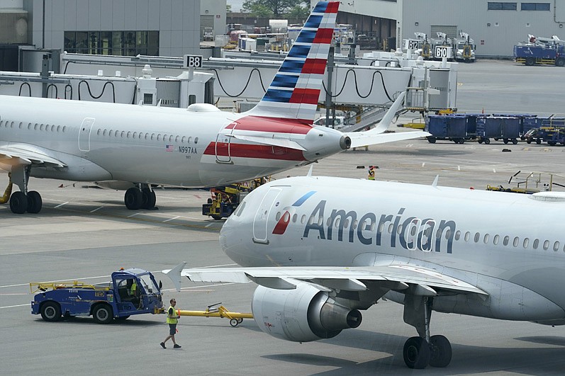 American Airlines passenger jets prepare for departure at Boston Logan International Airport. American, Southwest and Alaska Airlines posted their earnings for the third quarter Thursday.
(AP file photo/Steven Senne)