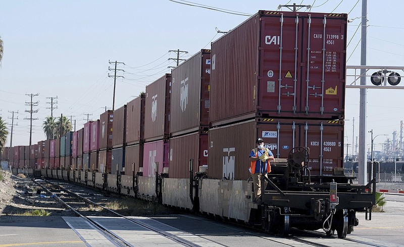 A trainload of containers heads to the Port of Los Angeles recently. Federal Reserve Chairman Jerome Powell says inflation is rising because of the global supply-chain squeeze.
(AP/The Orange County Register/Dean Musgrove)