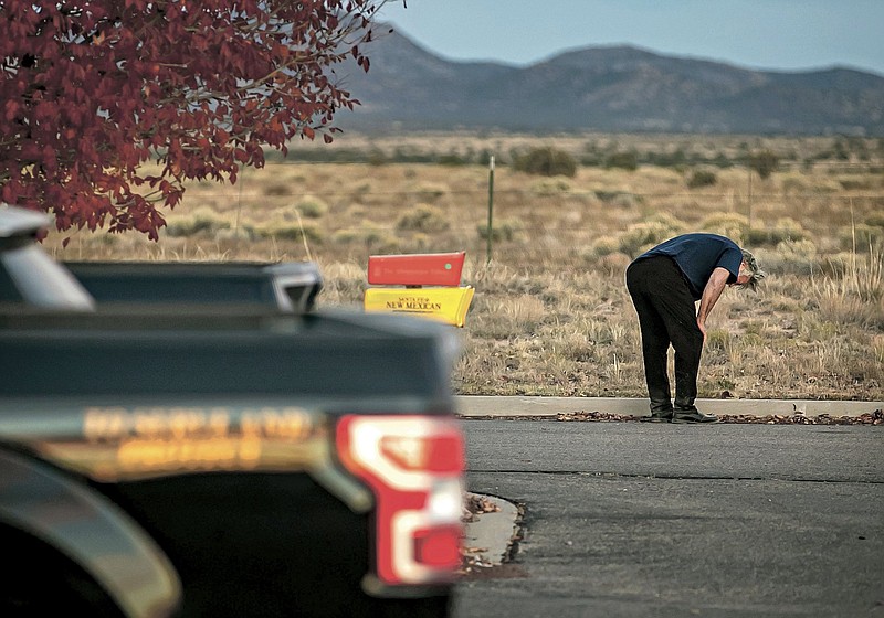 A distraught Alec Baldwin lingers in the parking lot of the Santa Fe County sheriff’s office in New Mexico on Thursday after he was questioned about the shooting on his film set.
(AP/Santa Fe New Mexican/Jim Weber)