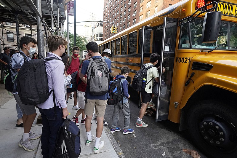 Students board a school bus on New York’s Upper West Side last month. Even as most students return to learning in the classroom this school year, disruptions to in-person learning, from missing one day because of a late school bus to an entire two weeks at home due to quarantine, remain inevitable as families and educators navigate the ongoing pandemic.
(AP/Richard Drew)