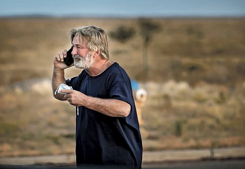 Alec Baldwin speaks on the phone Thursday in the parking lot outside the Santa Fe County sheriff’s office in Santa Fe, N.M., after he was questioned about a shooting on the set of the film “Rust” on the outskirts of Santa Fe. Video online at arkansasonline.com/1024baldwin/.
(AP/Santa Fe New Mexican/Jim Weber)