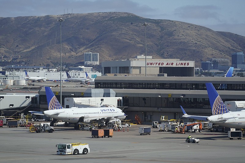 United Airlines planes are seen parked at San Francisco International Airport with a maintenance hangar in the background on in July, in San Francisco.
(AP/Eric Risberg)