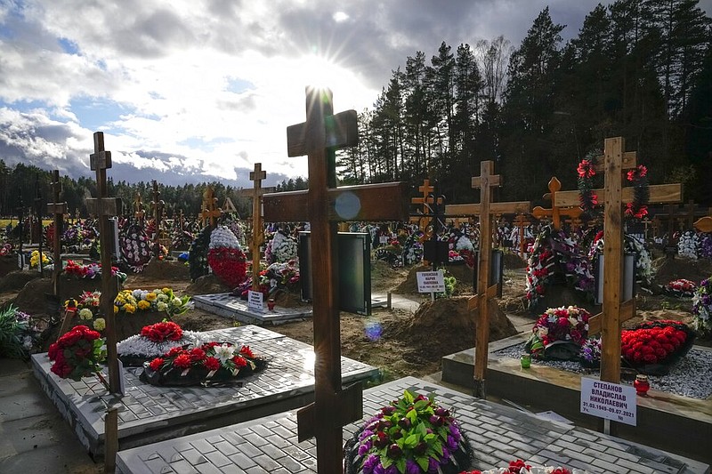 Graves and crosses are seen at the Yastrebkovskoe cemetery outside Moscow on Friday, Oct. 22, 2021. The cemetery serves as one of the burial grounds for Russians who have died of covid-19. (AP/Alexander Zemlianichenko)